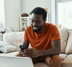 Man on his phone at home